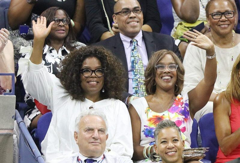 US television personality Oprah Winfrey, left, and Gayle King watch Serena and Venus Williams during their US Open quarter-final match on Tuesday. Andrew Gombert / EPA
