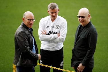 FILE PHOTO: Soccer Football - Champions League - Manchester United Training - Camp Nou, Barcelona, Spain - April 15, 2019 Manchester United manager Ole Gunnar Solskjaer and co owners Joel Glazer and Avram Glazer during training Action Images via Reuters/Carl Recine/File Photo