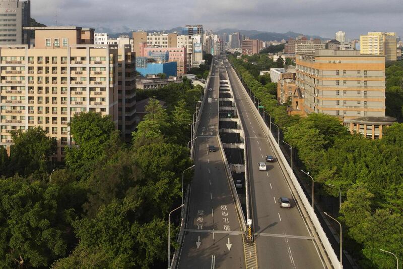 Near-deserted roads in Taipei, after Taiwan raised its coronavirus alert level following a surge in Covid-19 infections.  AFP