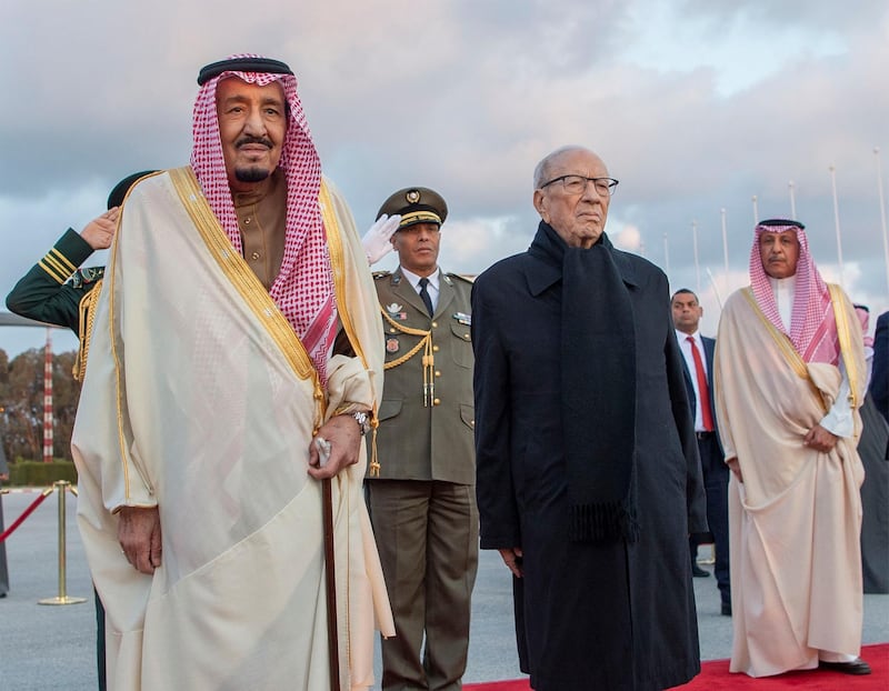 Essebsi posing for a picture during a welcoming ceremony at Tunis-Carthage International Airport with Saudi Arabia's King Salman. AFP Photo