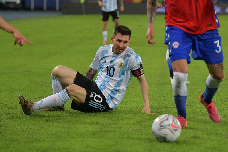 Lionel Messi falls during the Copa America 2021 match against Chile. AFP