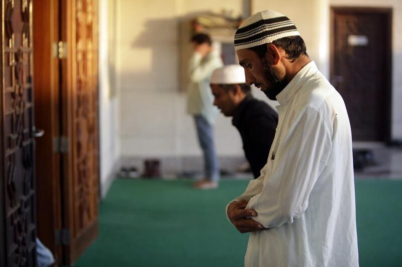 Worshipers gather at the Khalifia City Mosque for the Eid Al Adha prayers in Abu Dhabi. Sammy Dallal / The National