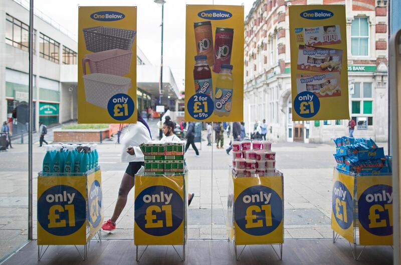 Pedestrians pass on the street outside a window display of a discount supermarket in Luton, U.K., on Wednesday, Sept. 2, 2020. The Bank of England is touting the firepower it can use to deliver more stimulus as the U.K. enters what could be a chaotic final few months of 2020. Photographer: Chris Ratcliffe/Bloomberg