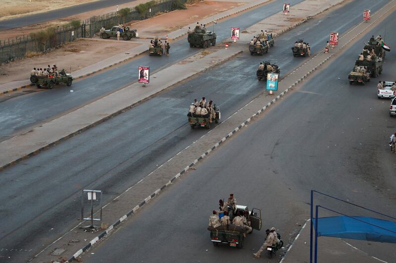 Members of the Rapid Support Forces, a paramilitary force operated by the Sudanese government, block roads in Khartoum. AP Photo