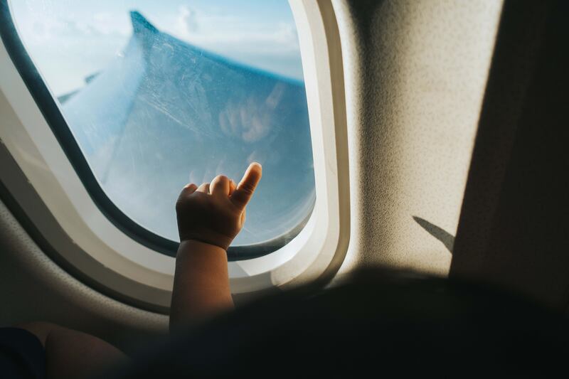 In-flight entertainment is a parent's best friend when flying with unruly children. Getty Images