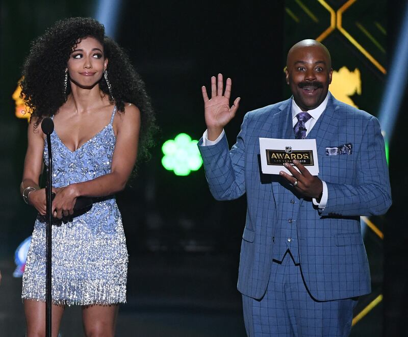Cheslie Kryst presents the James Norris Memorial Trophy as host Kenan Thompson, as his character Steve Harvey, looks on during the 2019 NHL Awards at the Mandalay Bay Events Center on June 19, 2019 in Las Vegas. Getty Images