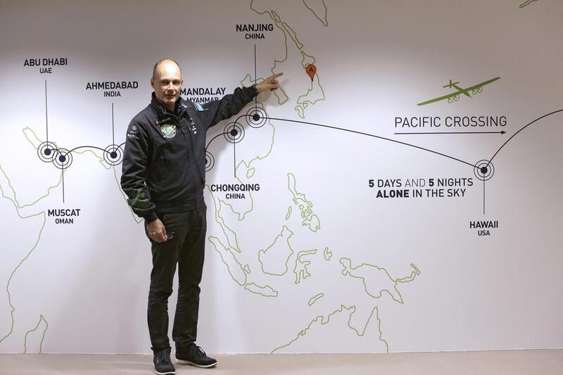 Bertrand Piccard, the initiator, chairman and pilot of Solar Impulse, points Japan on the map at the Mission Control Center for the Solar Impulse flight in Monaco yesterday. Lionel Cironneau / AP Photo

