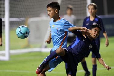 Players in action during the U-12 Mina Cup final match between Minerva Academy (light blue) and La Liga HPC club  (dark blue) held at Jebel Ali Centre of Excellence football pitches in Dubai. Pawan Singh / The National 