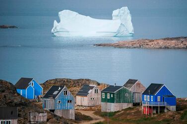 Icebergs float behind the town of Kulusuk in Greenland. AFP 