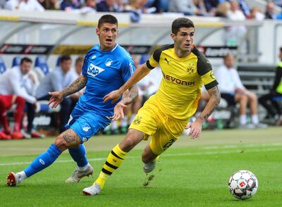 epa07258264 (FILE) Dortmund's Christian Pulisic (R) in action against Hoffenheim's Steven Zuber (L) during the German Bundesliga soccer match between TSG 1899 Hoffenheim and Borussia Dortmund in Sinsheim, Germany, 22 September 2018 (reissued 02 January 2019). FC Chelsea has signed Borussia Dortmund player Christian Pulisic, who has been loaned back to the German Bundesliga leaders until the end of the season.  EPA/ARMANDO BABANI CONDITIONS - ATTENTION:  The DFL regulations prohibit any use of photographs as image sequences and/or quasi-video *** Local Caption *** 54645249