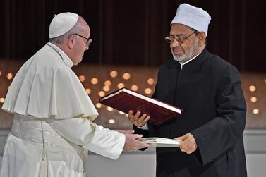 Pope Francis and Egypt's Azhar Grand Imam Sheikh Ahmed al-Tayeb greet each other after signing documents during the Human Fraternity Meeting at the Founders Memorial in Abu Dhabi in February. AFP