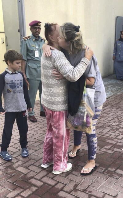 lodmela greets her daughter Mertes after she was released from jail over a bounced cheque. The family have now returned home to Uzbekistan. Zaina Abdul Al Kareem Ahmed