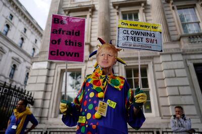 epa07784032 Anti-Boris Johnson demonstrator protests outside Downing Street, in London, Britain, 21 August 2019. British Prime Minister Boris Johnson is due to visit German Chancellor Angela Merkel in Berlin later today for talks on Brexit.  EPA/WILL OLIVER