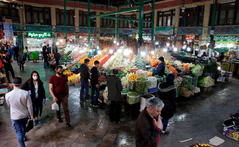 People, some wearing protective face masks, grocers stalls displaying produce at the Tajrish Bazaar in Iran's capital Tehran. Iran said on March 12 that it had asked the IMF for its first loan in decades to combat the COVID-19 coronavirus disease outbreak that has claimed 429 lives and infected more than 10,000 people. AFP