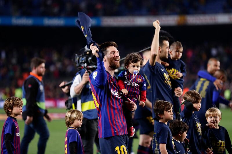 Messi celebrates with the trophy on a lap of honour with his teammates. AP Photo