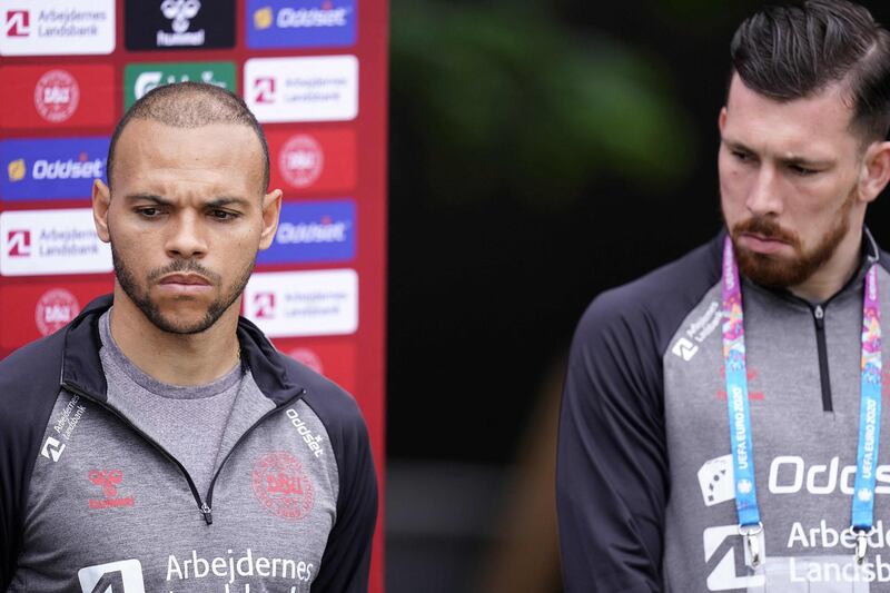 Denmark forward Martin Braithwaite and midfielder Pierre Hojbjerg appear before the press in the mixed zone at the team's base camp in Elsinore on June 14, 2021. The Danish squad trained without midfielder Christian Eriksen who collapsed during his country's opening Euro 2020 game against Finland, as the team doctor confirmed he had suffered a cardiac arrest. AFP