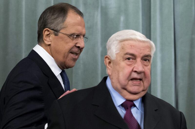 Russian foreign minister Sergei Lavrov, left, and his Syrian counterpart Walid Muallem meet in Moscow on Friday. Ivan Sekretarev / AP Photo