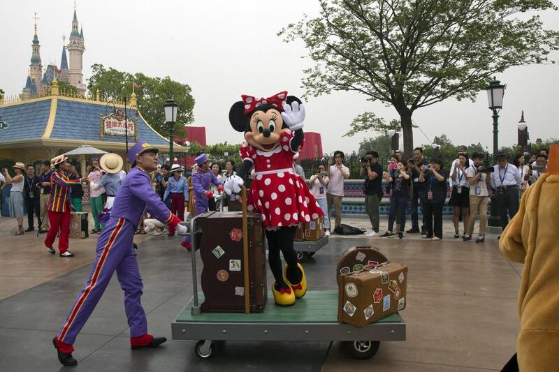 A Disney character takes part in a parade on the eve of the opening of the Disney Resorts in Shanghai. The debut of Shanghai Disneyland offers Walt Disney "incredible potential" for boosting its brand in the world's most populous market, said Disney's chief executive. Ng Han Guan/AP