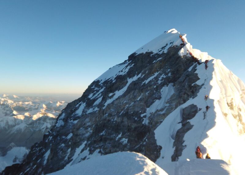 Climbers make their way to the summit of Everest. 11 people have died this season Reuters