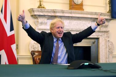 Boris Johnson throws his arms in the air as he declares 'A deal is done'