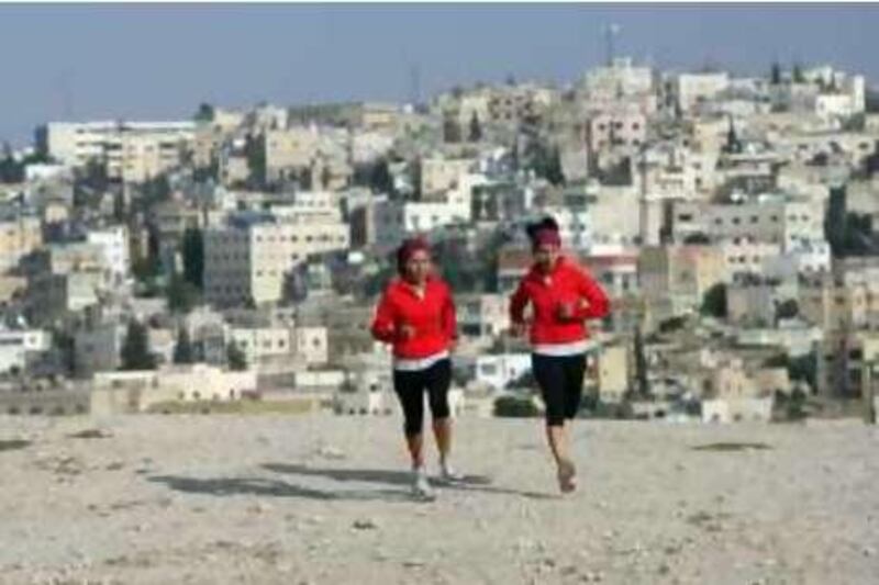 AMMAN, JORDAN: Jordanian twins Dima (L) and Lama Hattab exercise in Amman, Jordan on May 07, 2008 as they target to climb the Mount Everest. (Salah Malkawi/ The National)  *** Local Caption ***  SM009_Twins.jpg