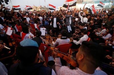 An Iraqi orchestra plays the national anthem as the demonestrators gather in front of Basra provincial building during protests, in Basra, Iraq November 2, 2019. REUTERS/Essam al-Sudani