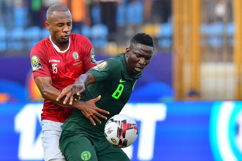 Madagascar midfielder Ibrahim Amada, left, vies for the ball with Nigeria's midfielder Oghenekaro Etebo. AFP