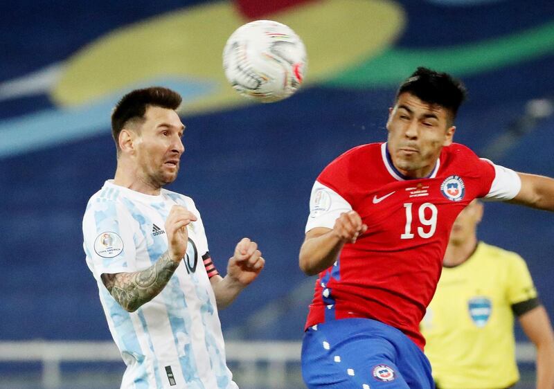 Chile's Tomas Alarcon in action with Argentina's Lionel Messi. Reuters