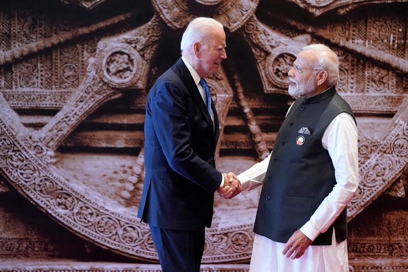 India's Prime Minister Narendra Modi welcomes US President Joe Biden to the G20 summit. AFP