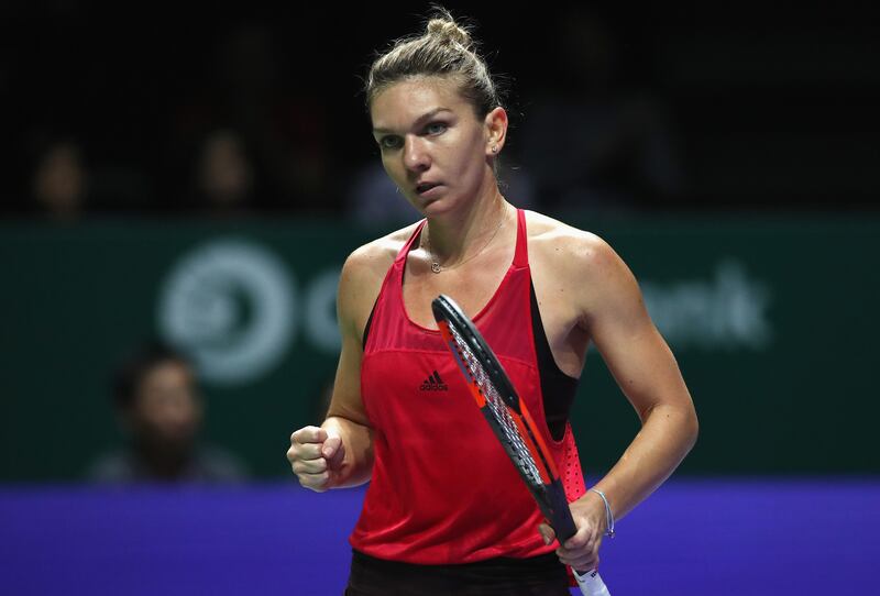 SINGAPORE - OCTOBER 23:  Simona Halep of Romania celebrates a point in her singles match against Caroline Garcia of France during day 2 of the BNP Paribas WTA Finals Singapore presented by SC Global at Singapore Sports Hub on October 23, 2017 in Singapore.  (Photo by Matthew Stockman/Getty Images)