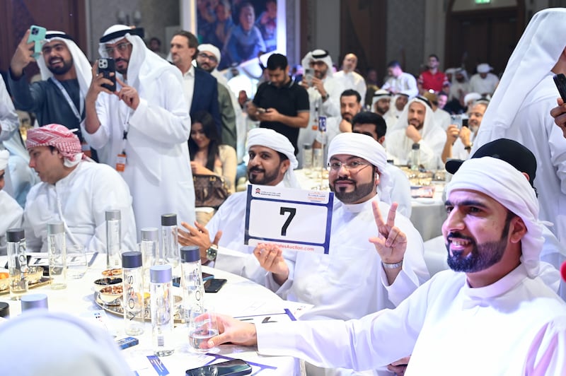 The winner of the Dubai 7 number plate at the charity auction