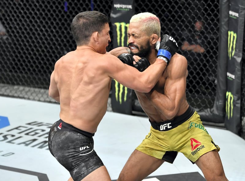 ABU DHABI, UNITED ARAB EMIRATES - JULY 19: (L-R) Joseph Benavidez and Deiveson Figueiredo of Brazil trade strikes in their UFC flyweight championship bout during the UFC Fight Night event inside Flash Forum on UFC Fight Island on July 19, 2020 in Yas Island, Abu Dhabi, United Arab Emirates. (Photo by Jeff Bottari/Zuffa LLC via Getty Images)