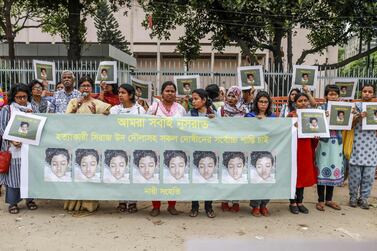 Bangladeshi women hold banners and photographs of schoolgirl Nusrat Jahan Rafi at a protest in Dhaka, following her murder. AFP / Sazzad Hossain