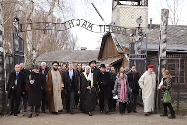 A delegation of Muslim religious leaders at the gate leading to the former Nazi German death camp of Auschwitz, together with a Jewish group in what organisers called “the most senior Islamic leadership delegation" to visit the former Nazi death camp, in Oswiecim, Poland on Thursday January 23, 2020. American Jewish Committee via AP
