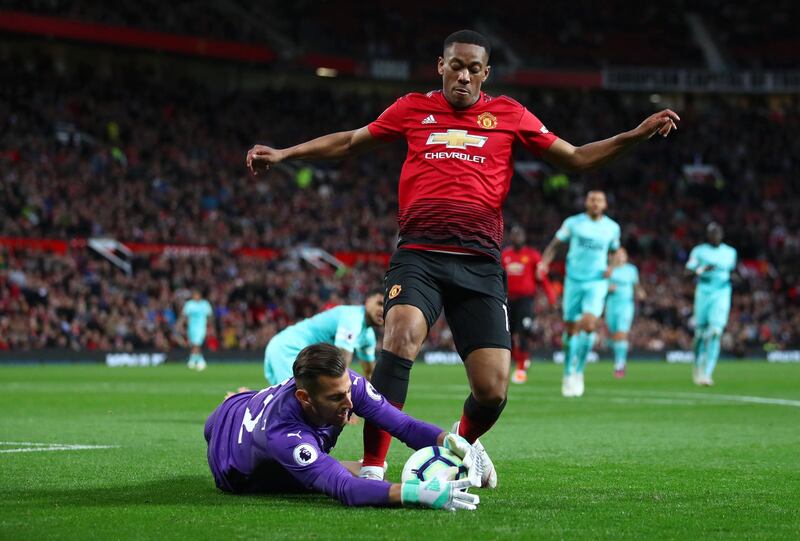 Martin Dubravka of Newcastle United and Anthony Martial of Manchester United vie for the ball. Getty Images