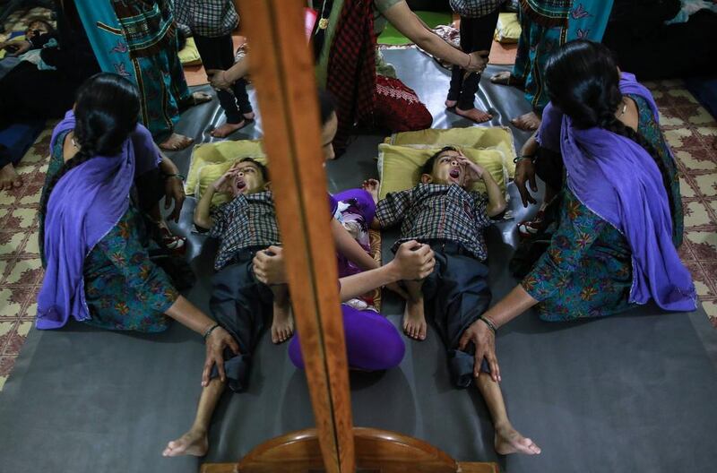 A boy receives treatment at a rehabilitation centre supported by Bhopal Medical Appeal for children who were born with mental and physical disabilities in Bhopal.