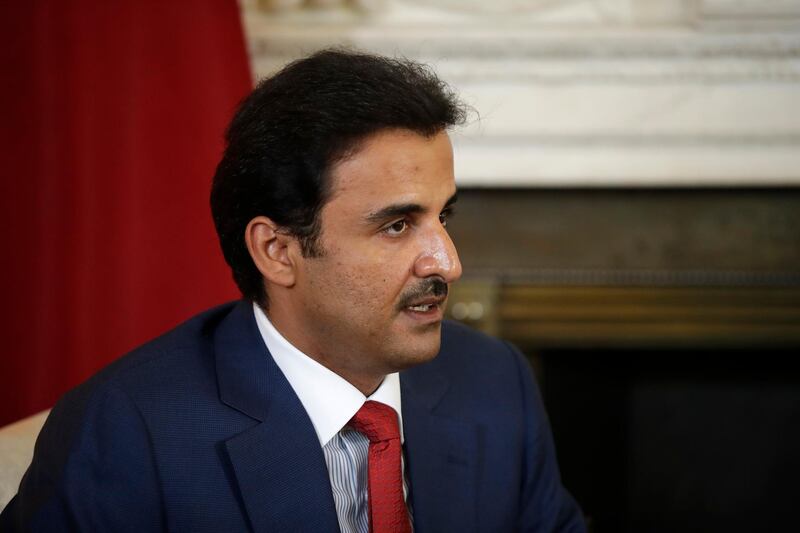 The Emir of Qatar Tamim bin Hamad Al Thani speaks with British Prime Minister Theresa May at the start of their meeting at 10 Downing Street in London, Tuesday, July 24, 2018. (AP Photo/Matt Dunham, Pool)