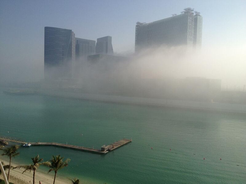 Abu Dhabi, Friday March 15th, 2013. Buildings on Al Maryah Island (Sowwah) wrapped in fog as the sun breaks through at 8:30.   Cool temperatures and dense fog shrouded much of Abu Dhabi island Friday morning. (Brian Kerrigan / The  National) 
(Editors note: Al Maryah Island (formerly Sowwah Island) has been classified as an investment zone, setting it at the forefront of Abu Dhabi's real estate opportunities. It is a 114 hectare mixed-use residential, retail, leisure, hotel and commercial development in the heart of Abu Dhabi. It is designated by the emirate's Urban Planning Council to be the capital's Central Business District (CBD). Sowwah Square is the exclusively commercial first phase of Abu Dhabi's new Central Business District (CBD). (Source: http://www.almaryahisland.ae/)