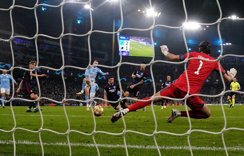 Erling Haaland shoots to score Manchester City's third goal against Copenhagen. PA