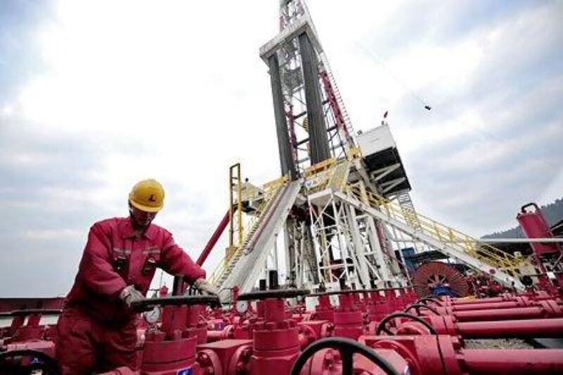 A worker checks the valves at a Sinopec natural gas appraisal well in China's Sichuan province. Reuters