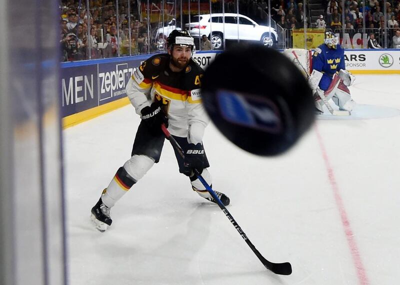 Germany´s Yasin Ehliz looks on as the puck flies towards the photographer during Sweden and Germany’s IIHF Ice hockey world championship first round match in Cologne. Patrik Stollarz / AFP Photo