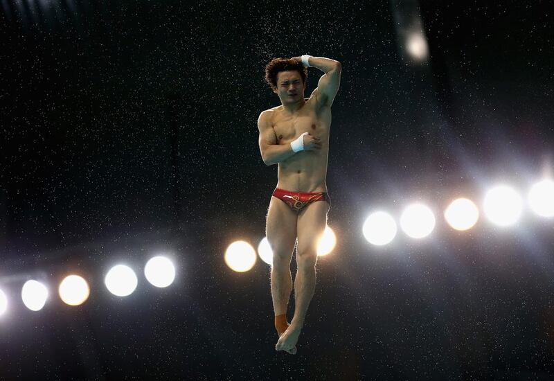 Bo Qiu of China dives at the Fina Diving World Series 2014 at the Hamdan Sports Complex. Warren Little / Getty Images  
