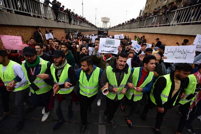Iraqi university students chant slogans during a strike and protests in central Baghdad.  EPA