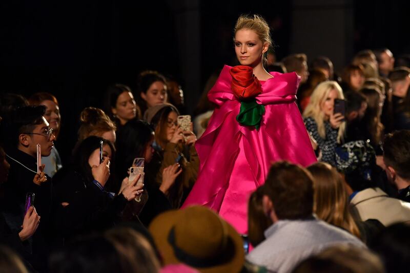 Models present creations by fashion house Richard Quinn during the catwalk show for their Autumn/Winter 2020 collection on the second day of London Fashion Week in London on February 15, 2020. (Photo by Ben STANSALL / AFP)