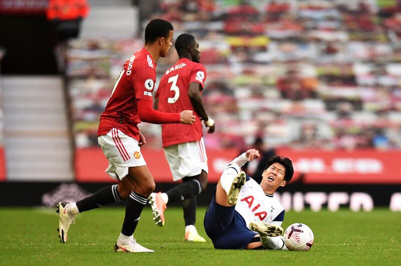 Son Heung-min goes down after being fouled by United defender Eric Bailly. Getty