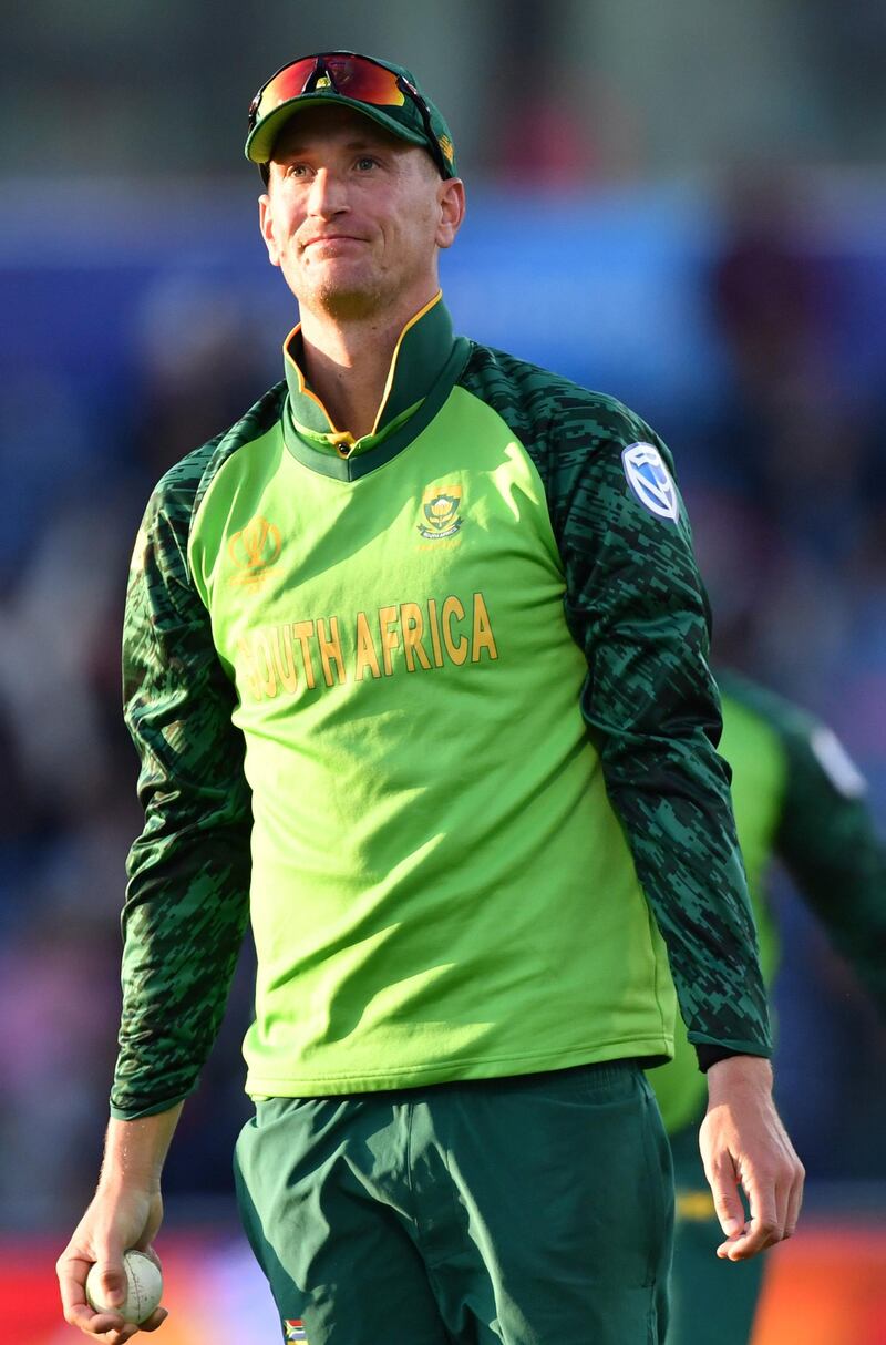 South Africa's Chris Morris celebrates with teammates after taking a catch to dismiss Australia's David Warner during the 2019 Cricket World Cup group stage match between Australia and South Africa at Old Trafford in Manchester, northwest England, on July 6, 2019. (Photo by Paul ELLIS / AFP) / RESTRICTED TO EDITORIAL USE
