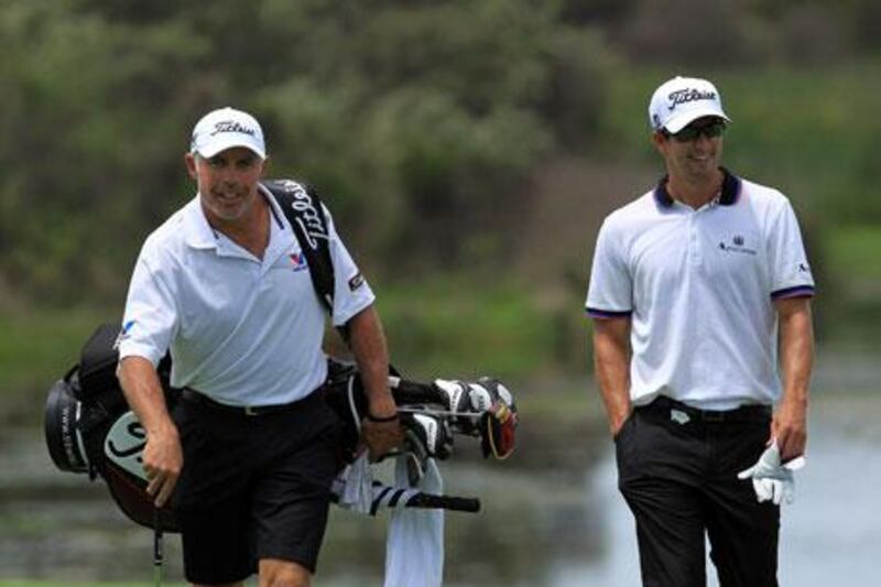 Steve Williams, left, has put his employer Adam Scott, right, in an awkward position with some demanding that he fire him.
