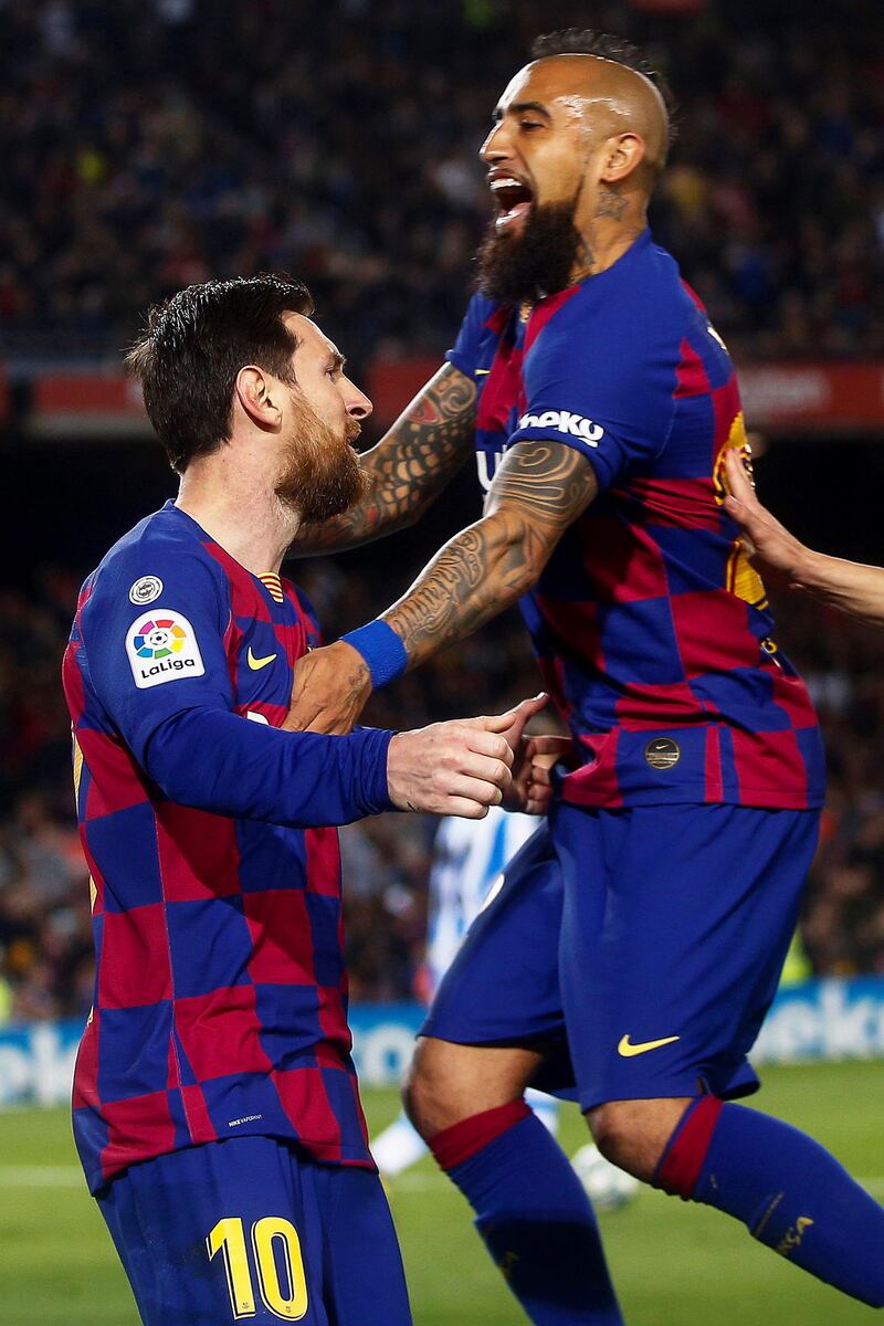 2. Barcelona - 4134 points. Lionel Messi celebrates with teammate Arturo Vidal . EPA