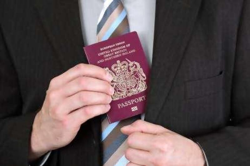 Businessman pressenting a British passport at customs or check in area
istockphoto.com
 *** Local Caption ***  pf05de-davey.jpg