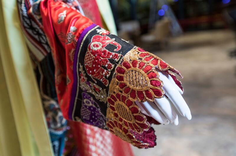 Ahmad's patchwork design blends locally sourced fabrics, hand-painted cloth from Africa, embroidery sequins from India, Chinese silk, Emirati Al Sadu textile and brocade from her mother’s wedding ensemble.